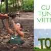 Tourists exploring the Cu Chi Tunnels in Vietnam, guided tour through underground war tunnels