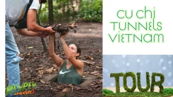 Tourists exploring the Cu Chi Tunnels in Vietnam, guided tour through underground war tunnels