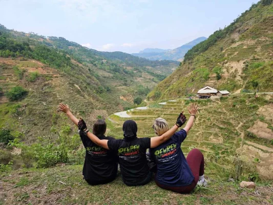 Riders on Rew Rew Adventures Easy Rider Tour Dalat To Ho Chi Minh 4 Days 3 Nights passing through Vietnam's Central Highlands with stunning mountain views, waterfalls, and ethnic villages