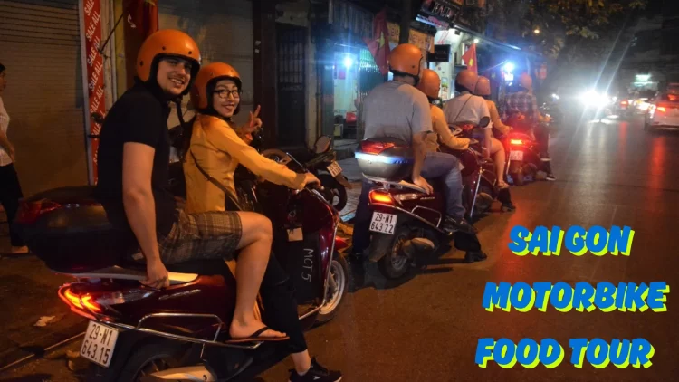 People on motorbikes enjoying street food in Saigon, Vietnam