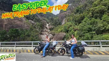 Easy Rider guide and traveler on a motorbike riding a winding mountain road between Nha Trang and Dalat